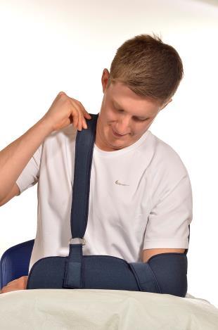 Support your arm on a pillow before you start. Slide your sling underneath the arm, so that your elbow is tucked into the corner of the sling, as shown. 2.