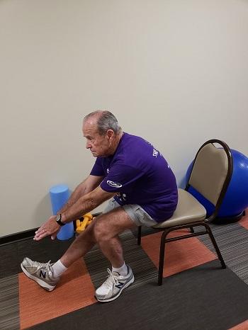 Sitting Hamstring and Lower Back Stretch (Sit and Reach) Sit toward the front edge of a chair. Keep one knee bent with foot flat on floor, straighten the other leg.