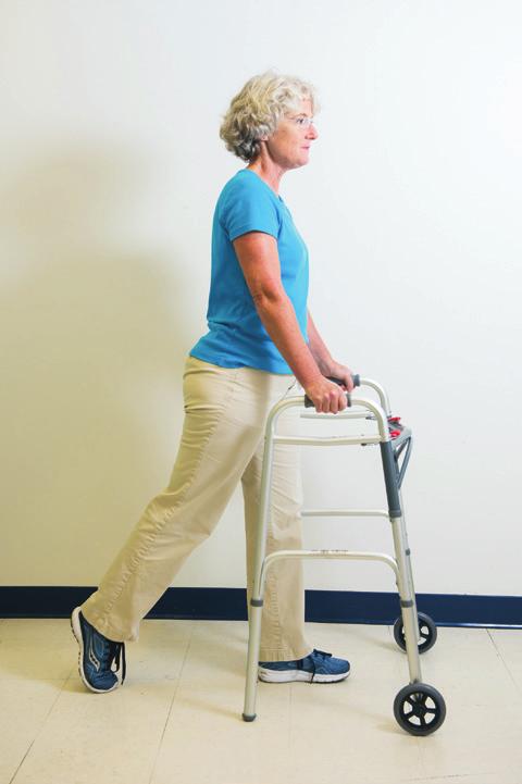 Using either a walker or forearm crutches, step forward with the surgical leg at the same time you