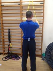 Upright Row Hold a barbell in both hands, resting it in front of your thighs with hands closer than shoulder width apart.