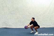Grasp a med-ball with both hands and keep elbows slightly bent. Assume a squat position. Draw your belly button inward toward your spine.