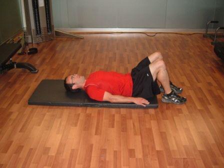 Workout A Lying Hip Extension Lie on your back with your knees bent and feet flat on the floor.