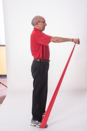 BICEPS CURL - BAND Stand with your feet hip-distance apart or sit in a chair with a straight back. Do not slouch in the chair.
