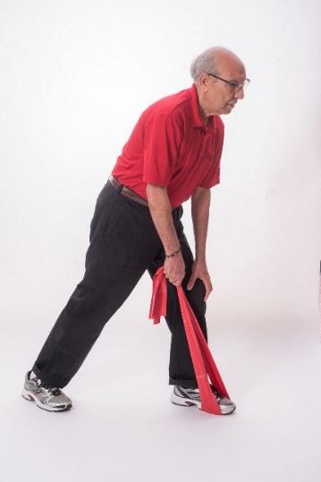 Grasp one or both ends of band in the right hand. Start with moderate tension on the band. Step back with your right leg.