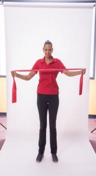 STANDING REVERSE FLY - BAND Stand with your feet hip-distance apart. Grasp one end of the band in each hand. Lift the arms to shoulder height.