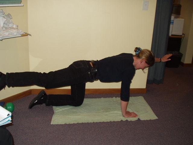 maintaining contraction Four point kneeling wrist under shoulders and knees under hips.