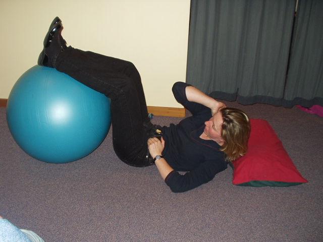 Trunk stability exercises On swiss ball Upper back strengthening Lie on your tummy over the ball Relax