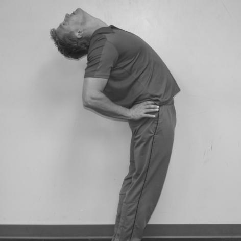 Spinal Backward Extension With knees straight, slowly extend
