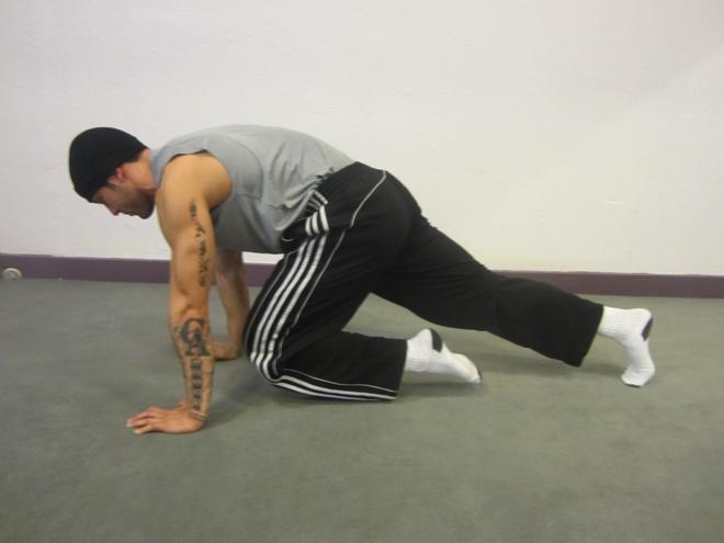Push- Up Kick Start with your legs straight back, hands placed to the side of the body. Elbows are bent as the chest, pelvis and thighs hover the floor.