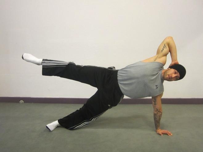 Oblique Kick Begin on your side. Place left hand down on the floor, opposite hand behind the head Extend both legs straight out onto the floor.