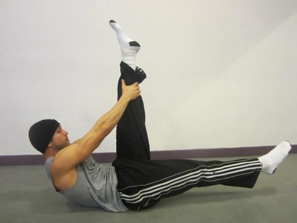 Ab Pull Lying on your back, extend left leg straight up while the right leg stays down to the floor. Chest lift up, goal is to have shoulder blades off the floor.