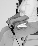 Wrist Flexion Goal: To increase strength of forearm and wrist. 1. Sit sideways in chair with your right side towards the back of the chair. Place a firm pillow on your lap. 2.