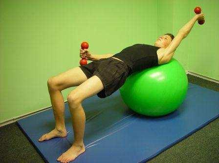 25. LYING SCISSORS: Lie with the ball under your shoulders and feet on the floor, hip width apart (knees at 90 ) Move your arms into an upright position.