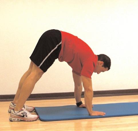 How To: Bend over from the waist and place both hands in front of you for support.