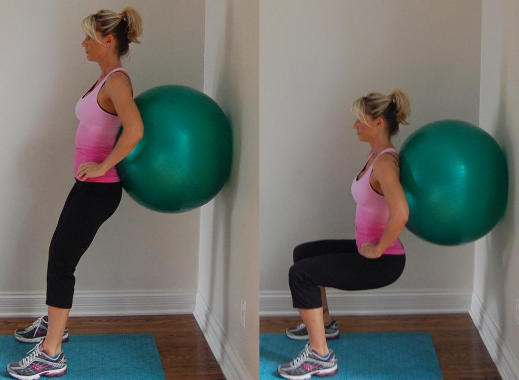 squat down, with hips moving under ball.