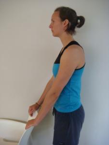 4. STANDING ARM STRETCH With hands