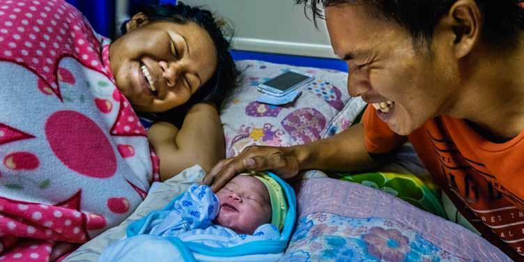 Report of the Regional Director Parents and their newborn baby relax at the Davao Regional Medical Center in the Philippines.