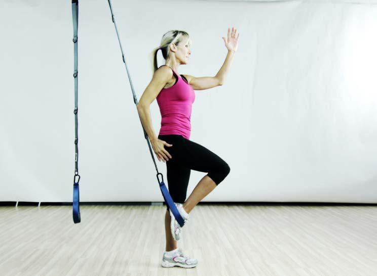 position Continue to alternate legs Stand facing away from the main straps and place one foot