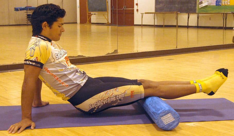 9.) Left Hamstring muscle group - Sit with the roller under your left thigh. - Place the palms of your hands on the ground (fingers pointing toward your body).