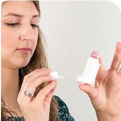 . Remove the cap on the spacer insert the mouthpiece of the inhaler into the opening at the end of the spacer.